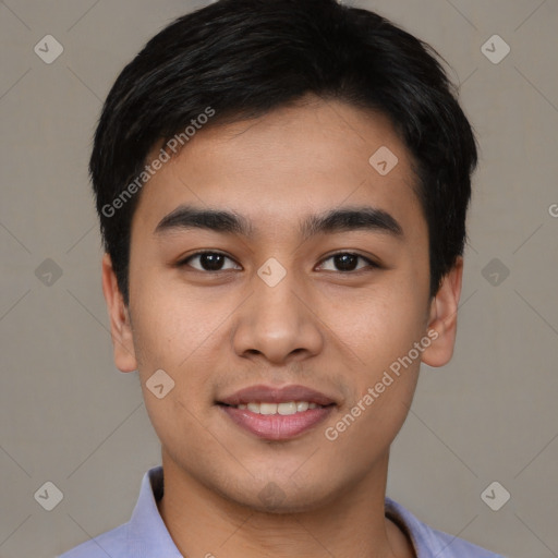 Joyful asian young-adult male with short  black hair and brown eyes