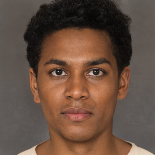 Neutral black young-adult male with short  brown hair and brown eyes