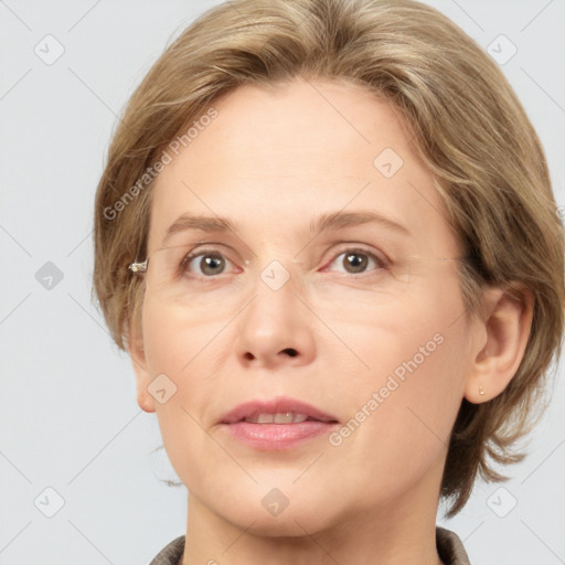 Joyful white adult female with medium  brown hair and grey eyes