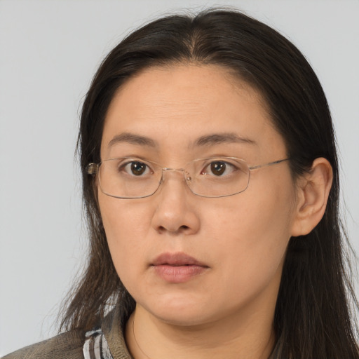 Neutral white adult female with long  brown hair and brown eyes
