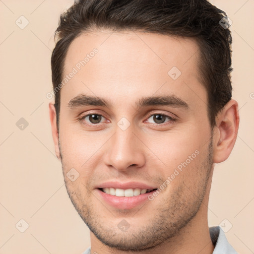 Joyful white young-adult male with short  brown hair and brown eyes