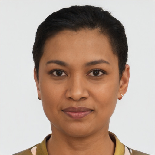 Joyful latino young-adult female with short  black hair and brown eyes