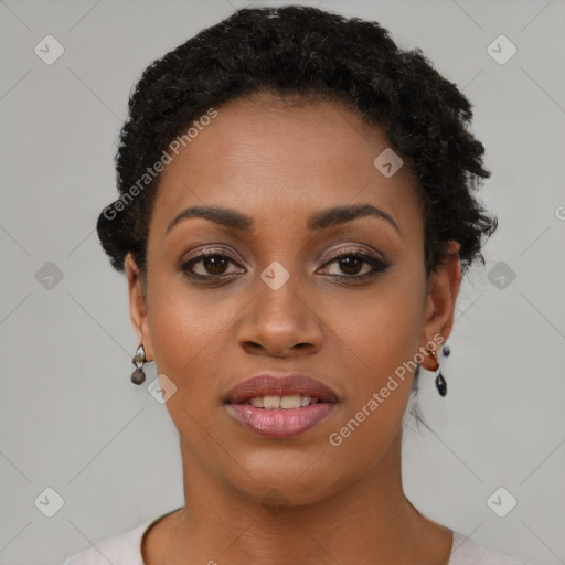 Joyful black young-adult female with short  brown hair and brown eyes