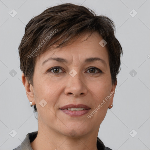 Joyful white adult female with short  brown hair and brown eyes