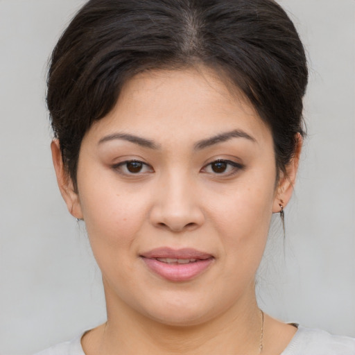 Joyful white young-adult female with medium  brown hair and brown eyes