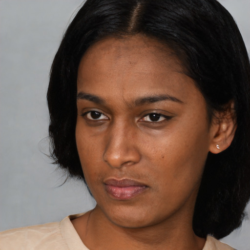 Neutral asian young-adult female with medium  black hair and brown eyes