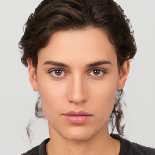 Neutral white young-adult female with short  brown hair and brown eyes