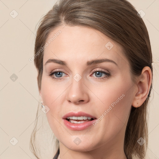 Joyful white young-adult female with long  brown hair and grey eyes