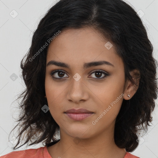 Joyful latino young-adult female with long  brown hair and brown eyes