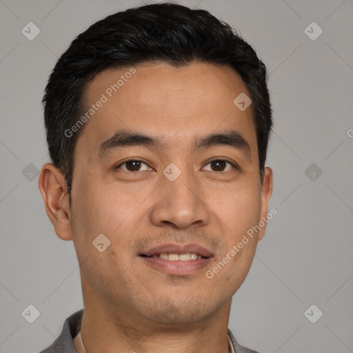 Joyful white young-adult male with short  black hair and brown eyes