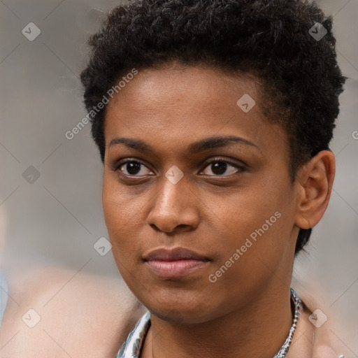 Joyful black young-adult female with short  brown hair and brown eyes