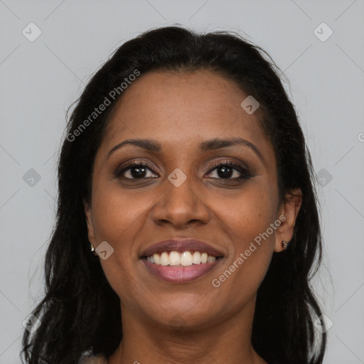 Joyful latino young-adult female with long  brown hair and brown eyes