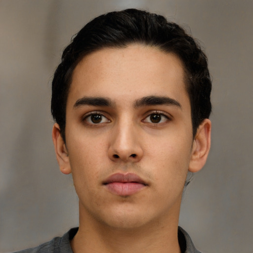 Neutral latino young-adult male with short  black hair and brown eyes