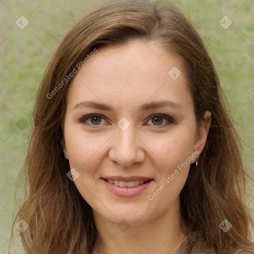 Joyful white young-adult female with long  brown hair and green eyes