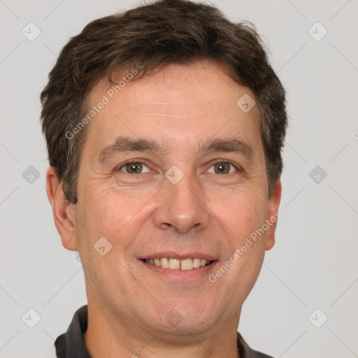 Joyful white adult male with short  brown hair and brown eyes