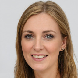 Joyful white young-adult female with long  brown hair and green eyes