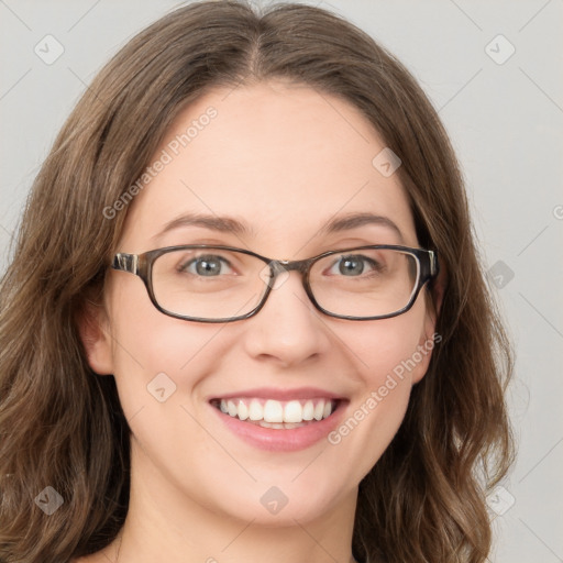 Joyful white young-adult female with long  brown hair and green eyes