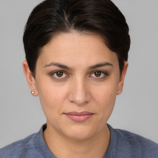 Joyful white young-adult female with short  brown hair and brown eyes