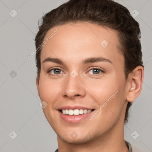 Joyful white young-adult female with short  brown hair and brown eyes