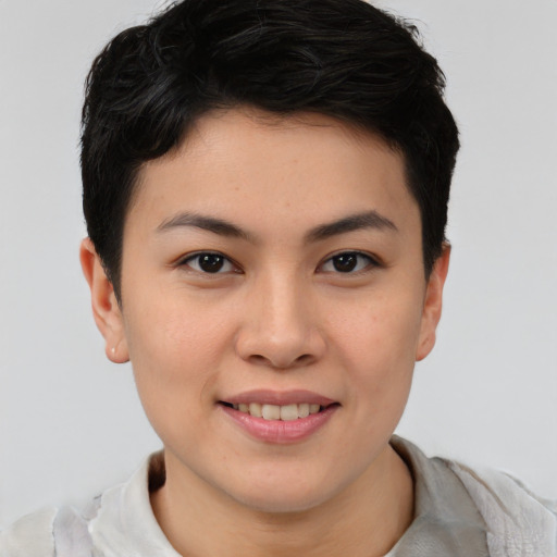Joyful asian young-adult female with short  brown hair and brown eyes