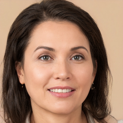 Joyful white young-adult female with medium  brown hair and brown eyes