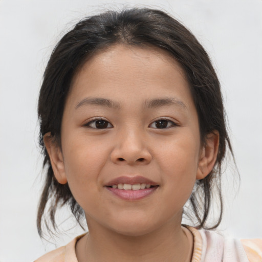 Joyful asian child female with medium  brown hair and brown eyes