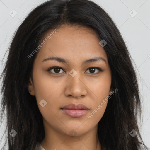 Joyful latino young-adult female with long  brown hair and brown eyes