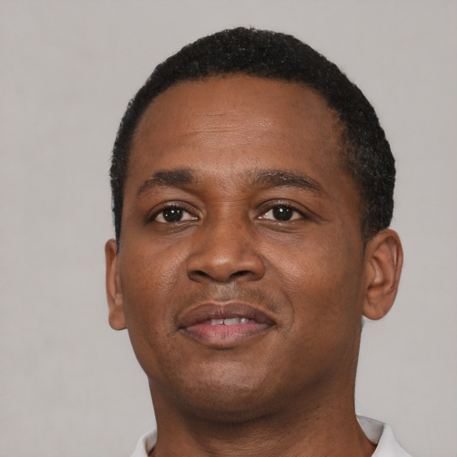Neutral black young-adult male with short  brown hair and brown eyes