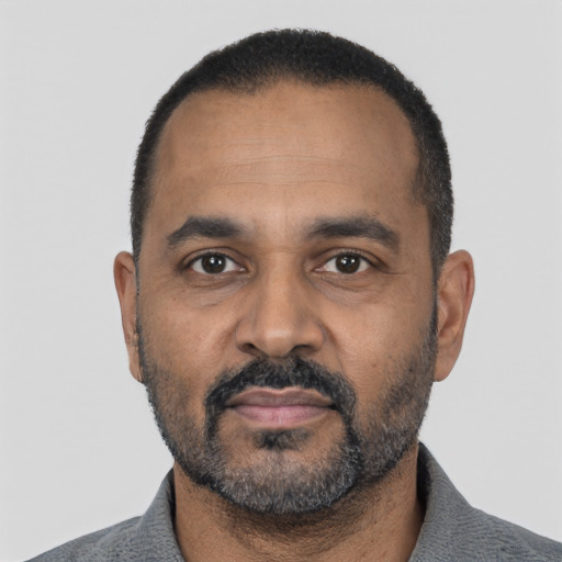 Neutral black adult male with short  black hair and brown eyes