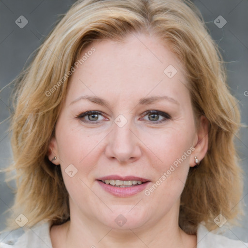 Joyful white adult female with medium  brown hair and blue eyes