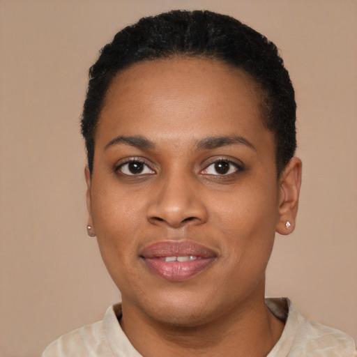 Joyful black young-adult female with short  black hair and brown eyes
