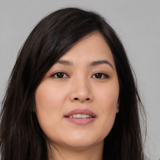 Joyful asian young-adult female with long  black hair and brown eyes