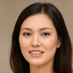 Joyful asian young-adult female with long  brown hair and brown eyes