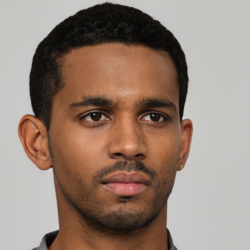 Neutral black young-adult male with short  black hair and brown eyes
