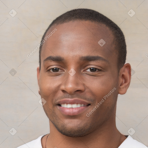 Joyful black young-adult male with short  brown hair and brown eyes