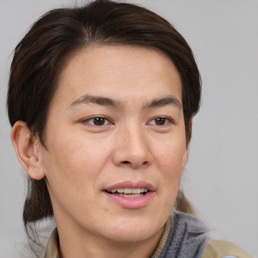 Joyful white young-adult male with medium  brown hair and brown eyes