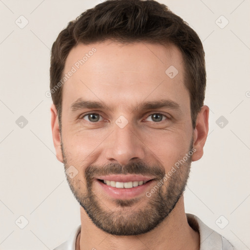 Joyful white young-adult male with short  brown hair and brown eyes