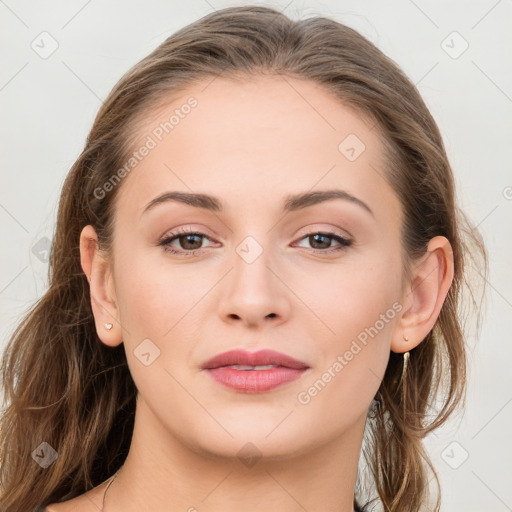 Joyful white young-adult female with long  brown hair and grey eyes