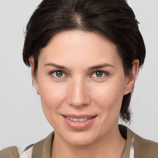 Joyful white young-adult female with medium  brown hair and brown eyes