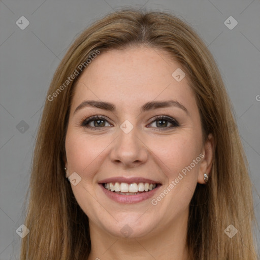 Joyful white young-adult female with long  brown hair and brown eyes