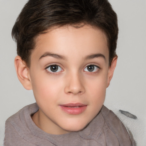 Joyful white child female with short  brown hair and brown eyes