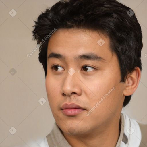 Neutral white young-adult male with short  black hair and brown eyes