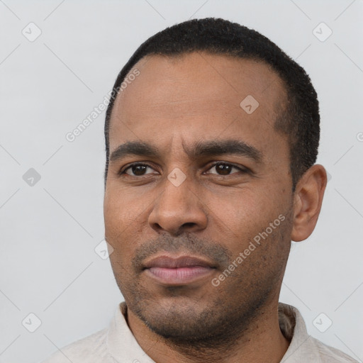 Neutral latino young-adult male with short  black hair and brown eyes