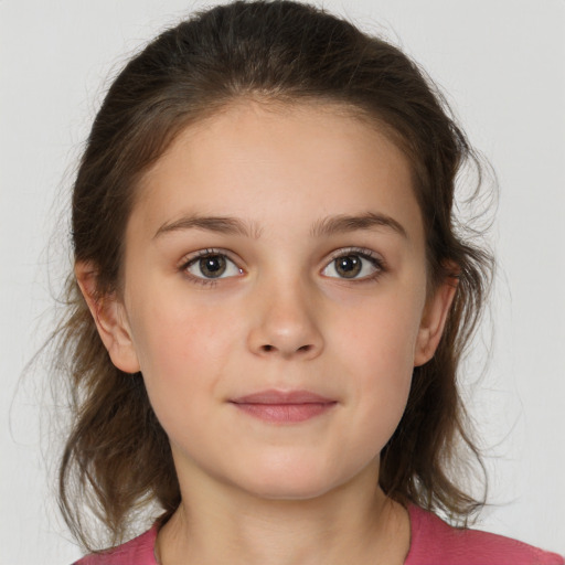 Joyful white child female with medium  brown hair and brown eyes