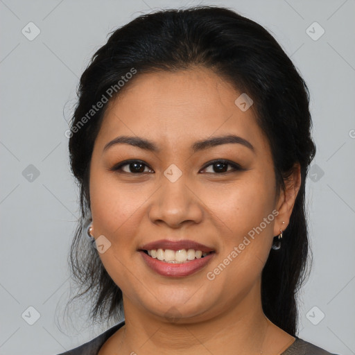 Joyful latino young-adult female with medium  brown hair and brown eyes