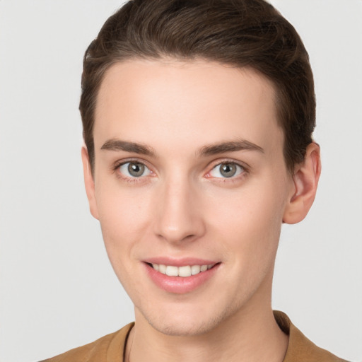 Joyful white young-adult female with short  brown hair and grey eyes