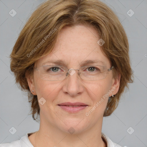 Joyful white adult female with medium  brown hair and blue eyes