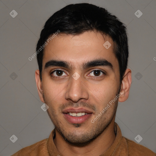 Joyful white young-adult male with short  black hair and brown eyes