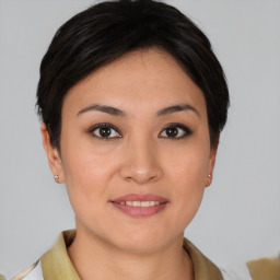 Joyful asian young-adult female with short  brown hair and brown eyes