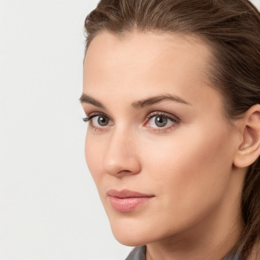 Neutral white young-adult female with long  brown hair and brown eyes